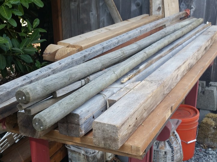 A pile of old wood in various lengths and dimensions