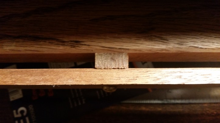 Closeup of the gap at the front of the frame's bed for the sewing keys.