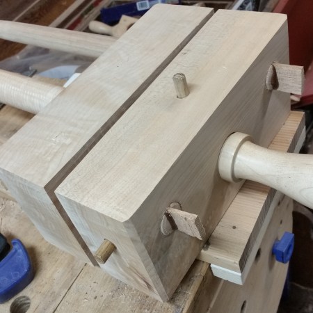 The almost completed bookbinder's plough. Oak pegs and wedges secure the rails and lock the handscrew in place.
