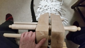 A book plough at work, trimmings piled around it, and a black cat