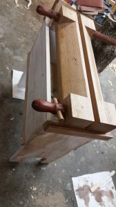 a modern book press sitting atop a trough