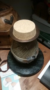 A ball of hemp on a spindle with a cork top